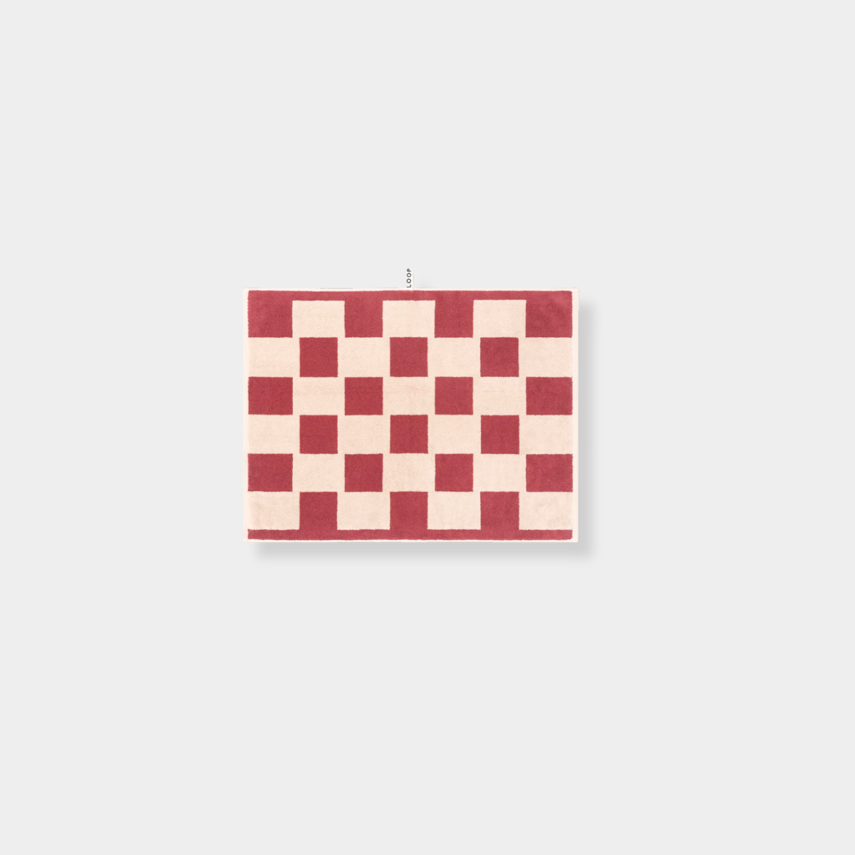Loop Home Bath Mat in Ruby and Almond Blush brick pattern made of GOTS organic cotton, 80x60 cm, jacquard weave.