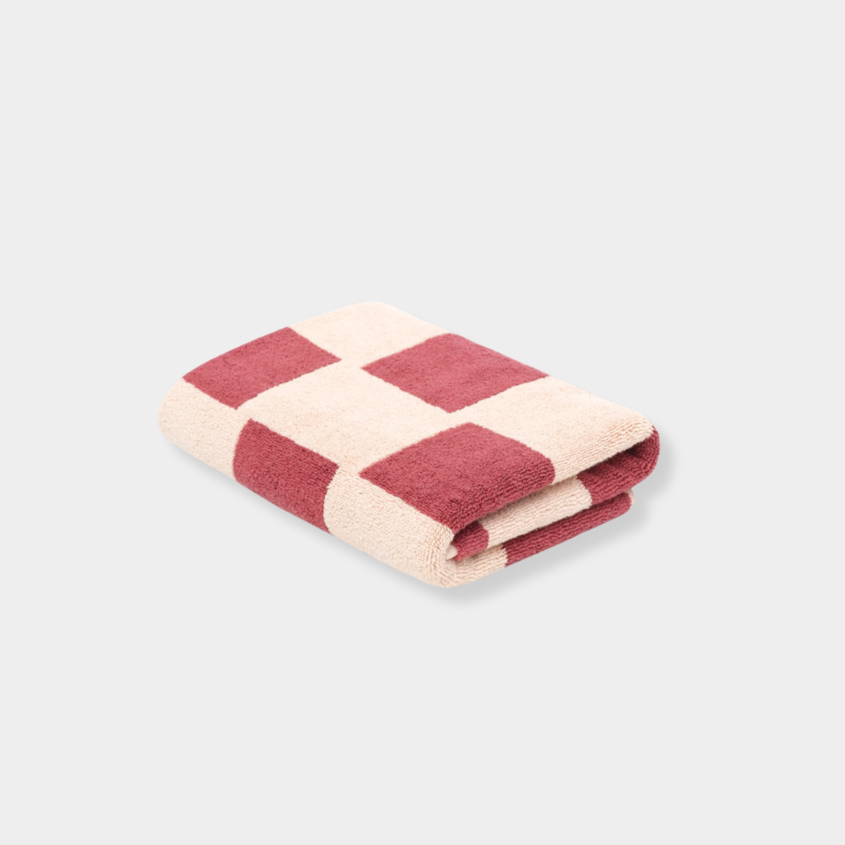 Folded Loop Home Bath Mat in ruby and almond blush brick color with organic cotton jacquard weave design
