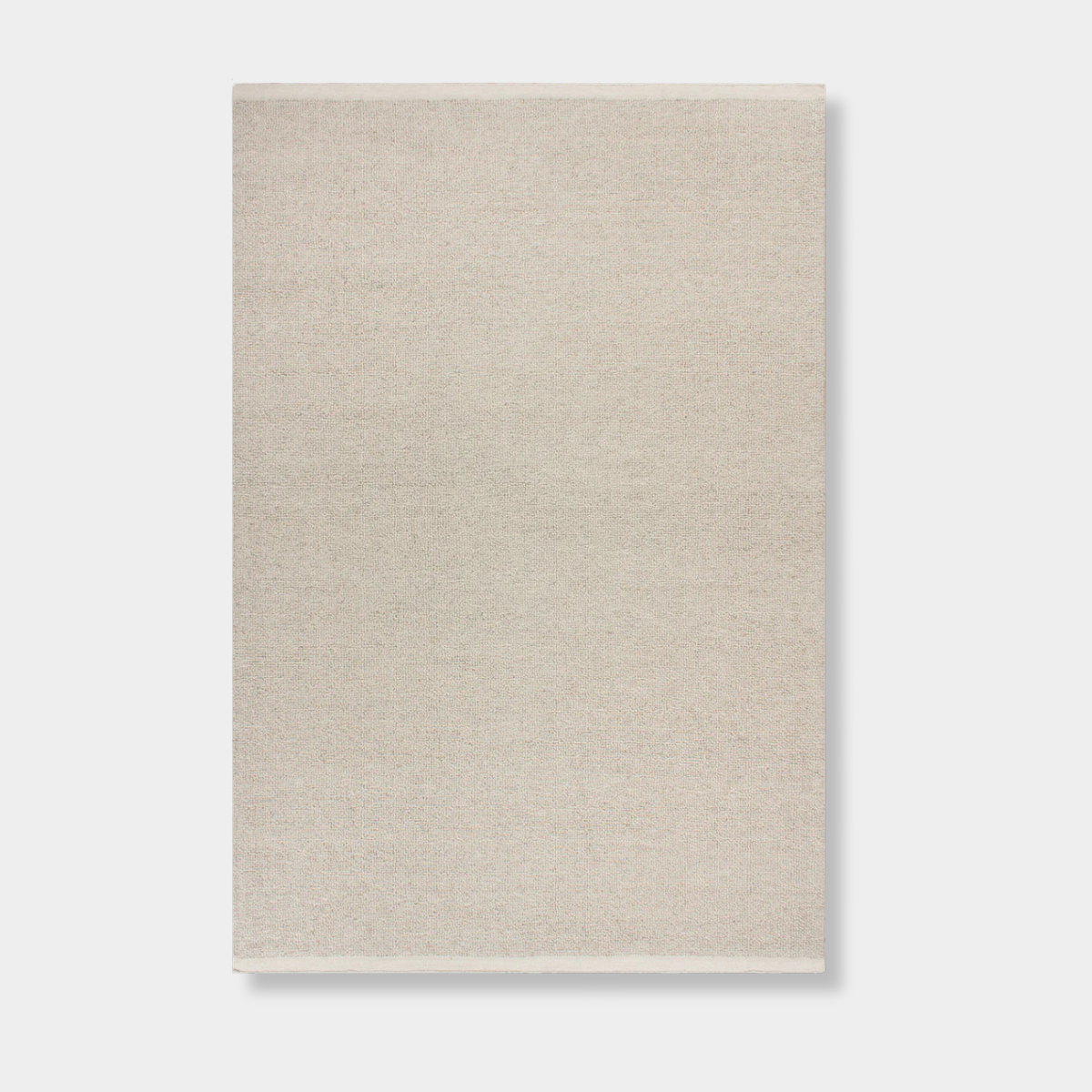 Baya Clifton Floor Rug in bone color, handcrafted 100% New Zealand wool with softly looped pile and flat edge finish.