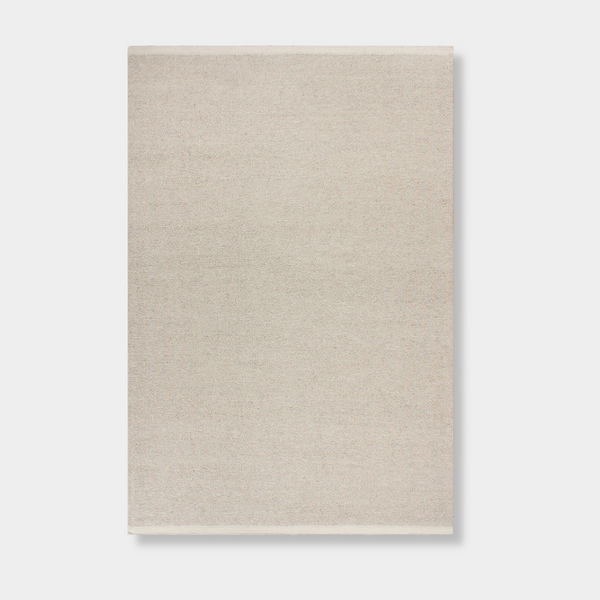 Baya Clifton Floor Rug in bone color, handcrafted 100% New Zealand wool with softly looped pile and flat edge finish.
