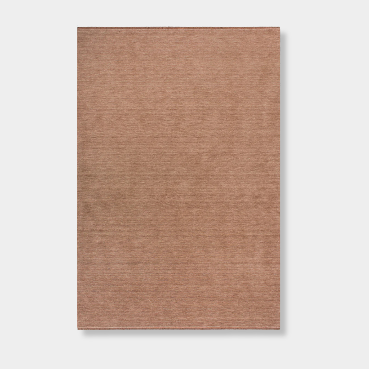 Baya Sandringham Floor Rug in rosewood pink, hand-knotted 100% NZ wool with dense loop pile and delicate fringing, rectangular shape.