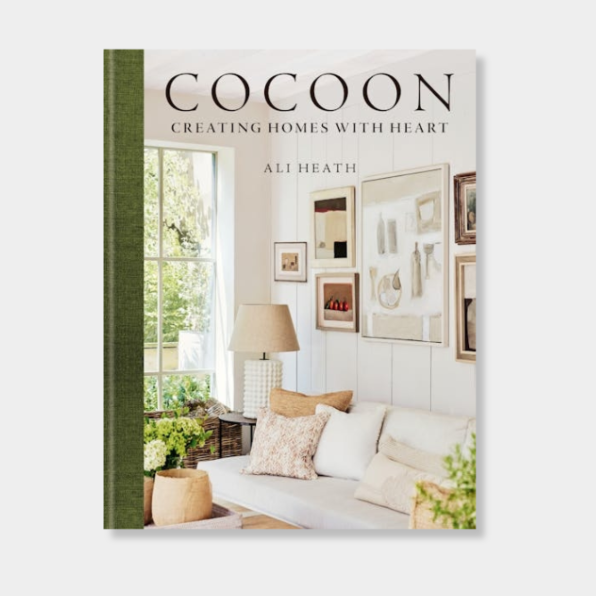 Cocoon by Ali Heath book cover featuring a cozy, stylish living room with neutral decor and art on walls