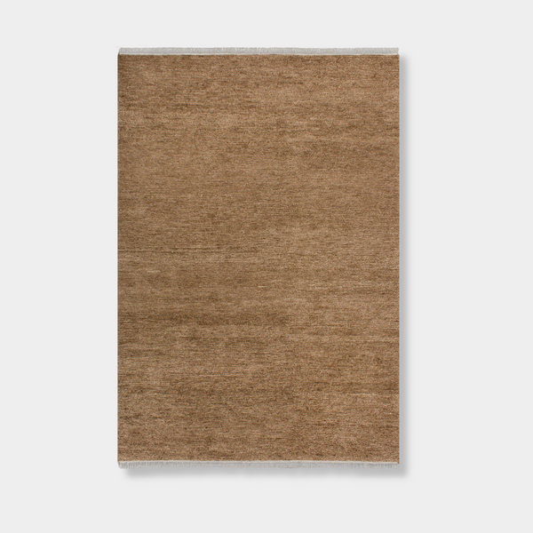 Baya Tanami Floor Rug in warm treacle color with hand-knotted ribbed texture, 100% New Zealand wool, soft cotton fringe, low-profile design