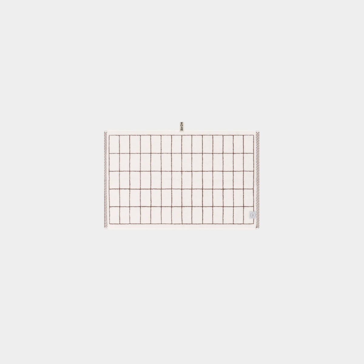 Loop Home Hand Towel in coffee and ivory tile pattern made from organic cotton