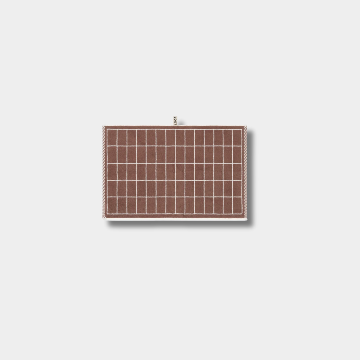 Loop Home Hand Towel in coffee and ivory tile pattern made from organic cotton