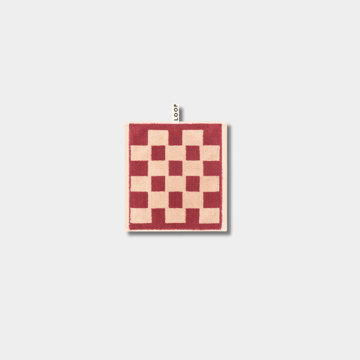 Loop Home Face Towel in brick color with jacquard weave made from organic cotton