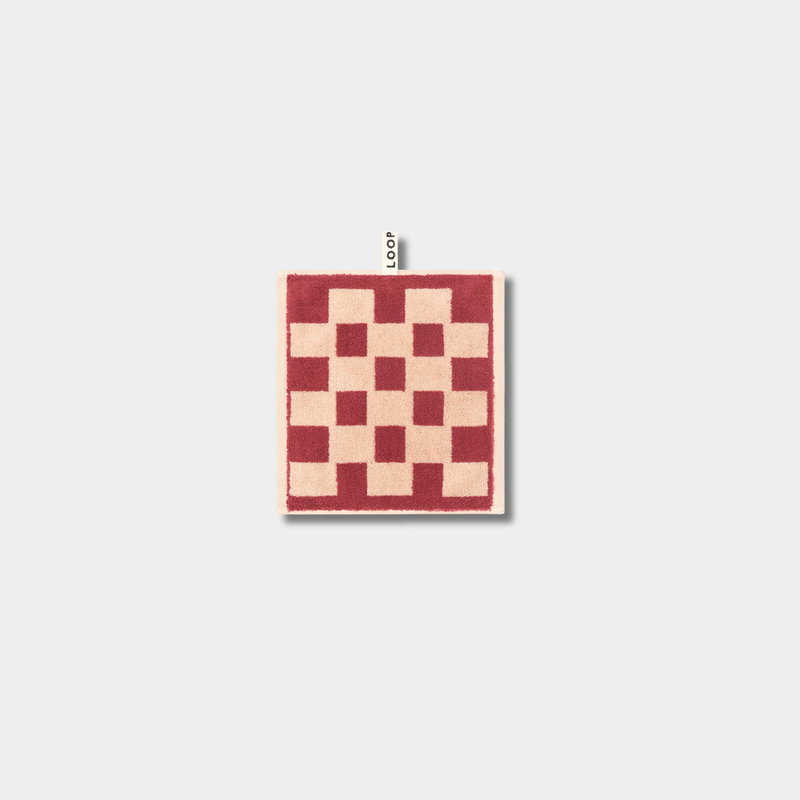 Loop Home Face Towel in brick color with jacquard weave made from organic cotton