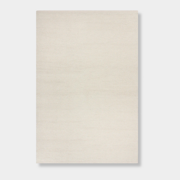 Baya Clifton Floor Rug in ivory, handcrafted 100% New Zealand wool with hand-knotted loop pile and flat edge finish.