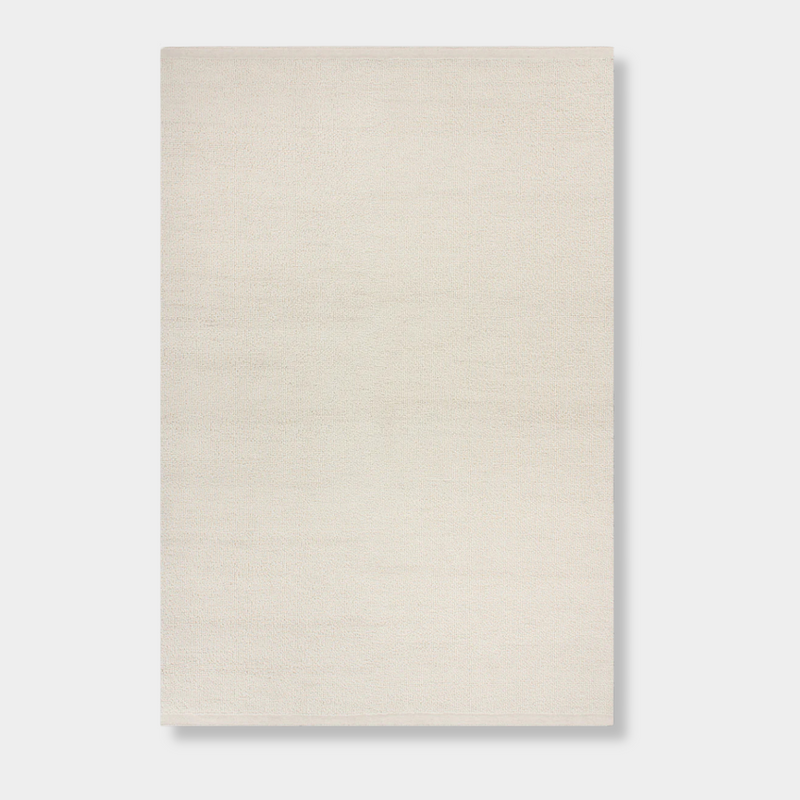 Baya Clifton Floor Rug in ivory, handcrafted 100% New Zealand wool with hand-knotted loop pile and flat edge finish.