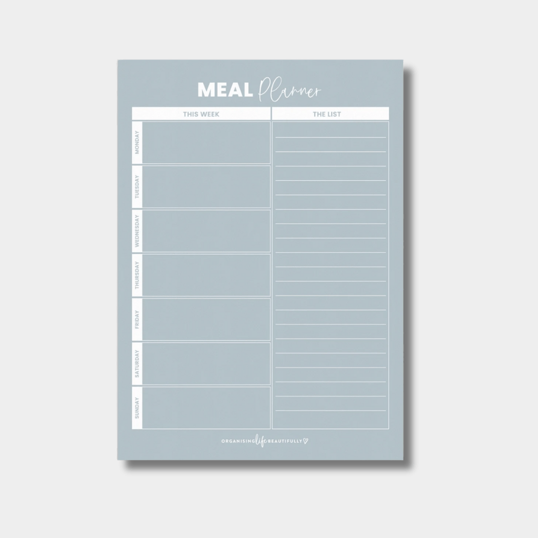 Sky blue magnet meal planner with weekly menu layout and shopping list section for fridge organization