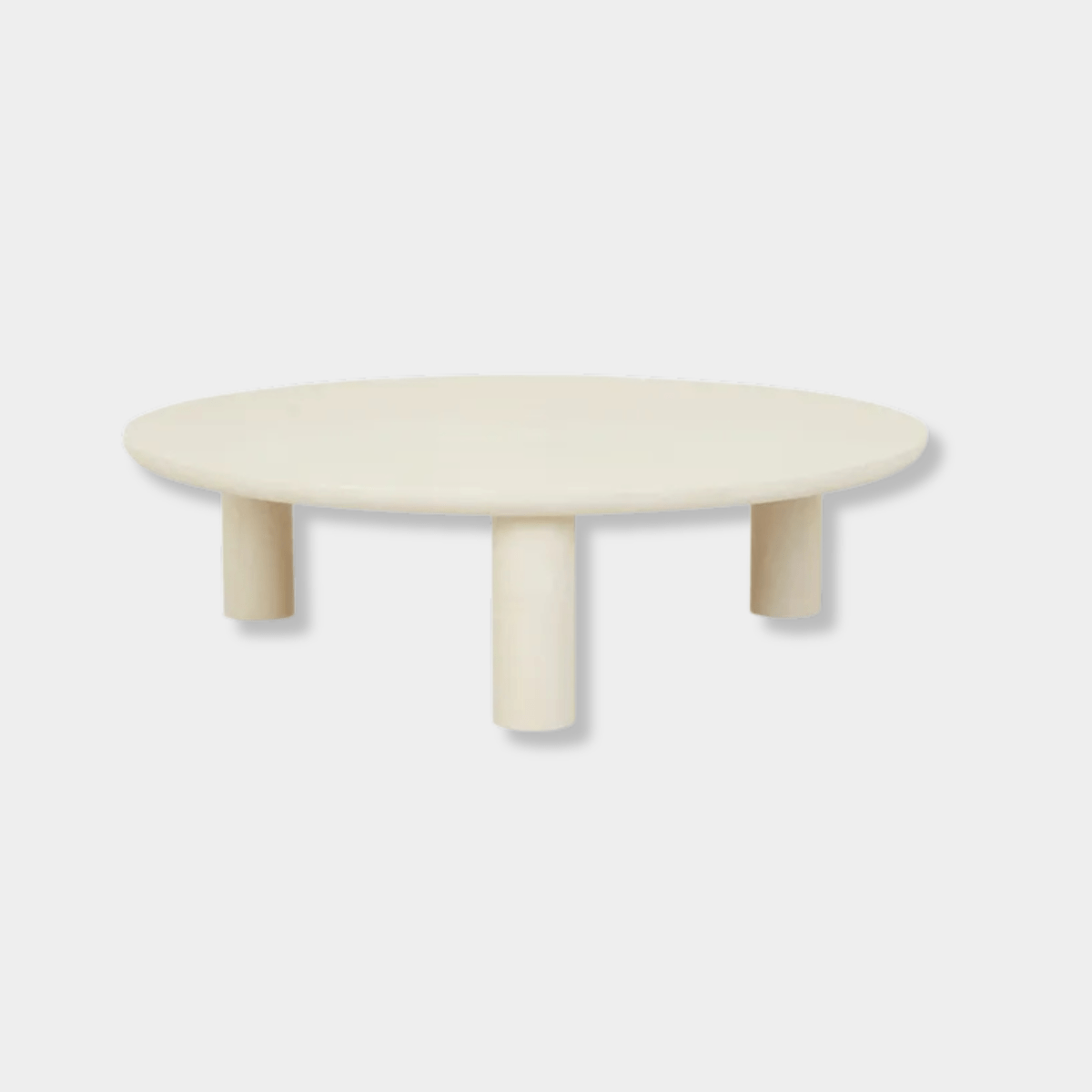GlobeWest Seb Round Coffee Table with rope-colored claylime finish and three chubby pillar legs, modern low-profile design