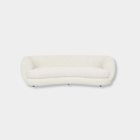 GlobeWest Hugo Vera 4 seater sofa in oat boucle with rounded edges and plush cushioning.