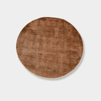 GlobeWest Tepih Neptune round ginger rug made of wool, silk, and cotton, hand woven, indoor use, stylish and textured circular area rug.