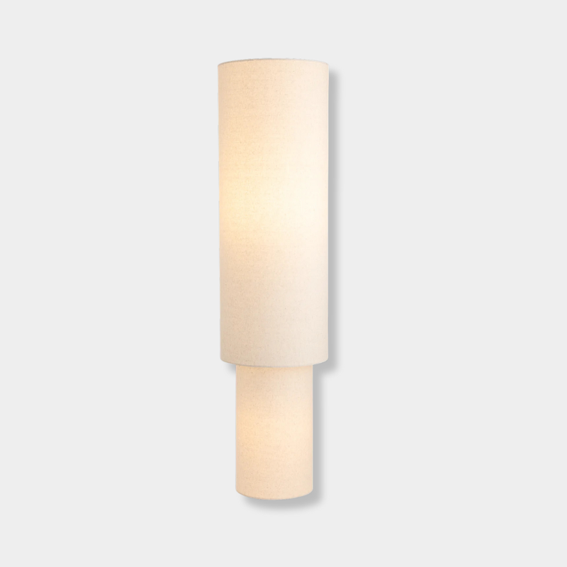 Sable Floor Lamp with linen double-cylinder shade providing soft diffused light in minimalist room setting