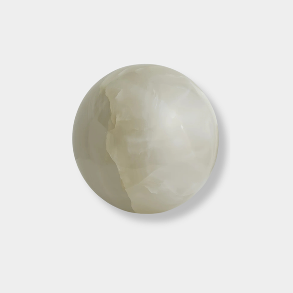 Large white onyx Orbit Table Sculpture sphere symbolizing harmony and balance