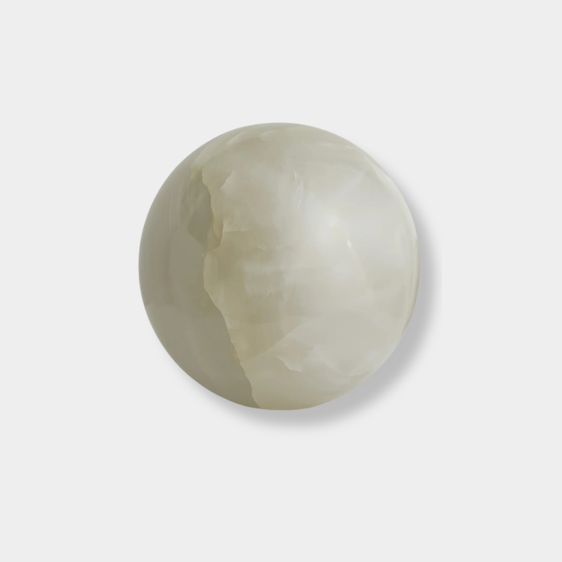 Large white onyx Orbit Table Sculpture sphere symbolizing harmony and balance