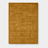 Hand-loomed Tait Rug in vibrant turmeric color with textured tip-sheared finish.