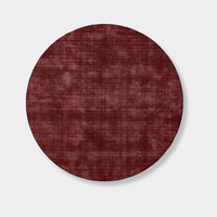 Round Tait Rug in dark cherry red, hand-loomed New Zealand wool with textured finish