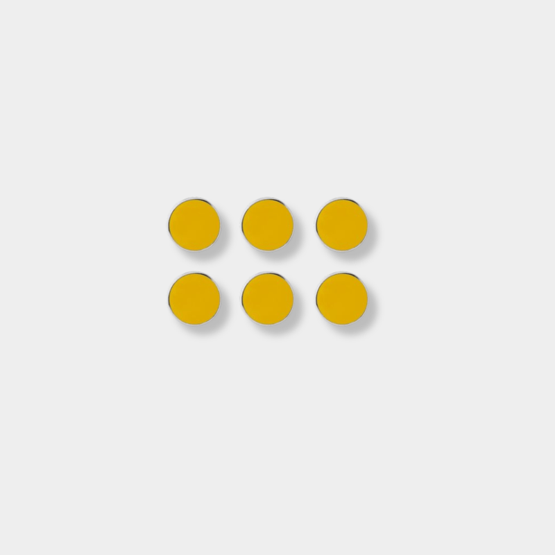 Set of six mustard yellow magnetic buttons by Mustard Made with smooth flat surface and shiny edges, ideal for decorating and organizing.