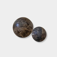 CoTheory Orbit Table Sculpture brown Emperador marble sphere symbolizing harmony and balance