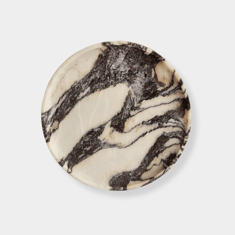 Linea Round Marble Tray made of natural Calacatta Viola marble with black and white organic veins.