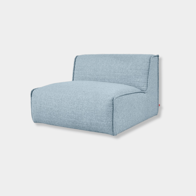 Gus Nexus armless modular sofa with two chairs and ottoman in Parliament Lake fabric