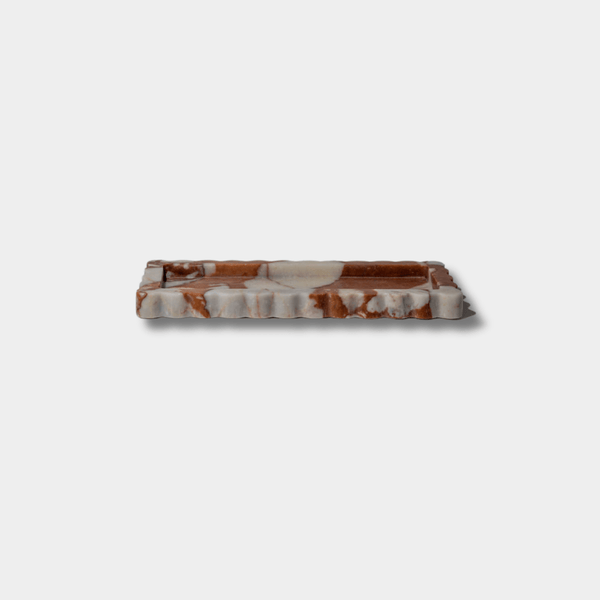 Palazzo Scalloped Marble Bar Tray in brown calacatta with scalloped edges and narrow profile, crafted from luxurious marble.