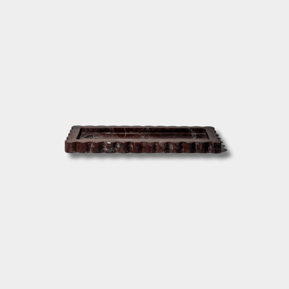 CoTheory Palazzo Scalloped Rectangular Marble Tray in Rosso Levanto with scalloped edges and narrow profile for elegant home décor.