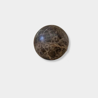 CoTheory Orbit Table Sculpture brown Emperador marble sphere symbolizing harmony and balance