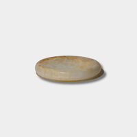 CoTheory Onyx Tray Solstice small white onyx round sculpted tray with natural stone variations and felt pads