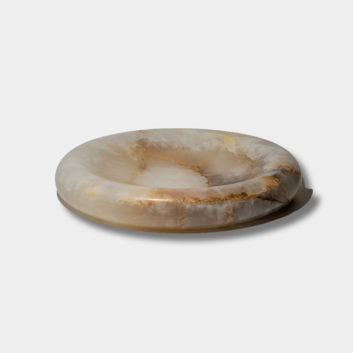 Large white onyx sculpted tray by CoTheory with smooth curves and natural stone patterns