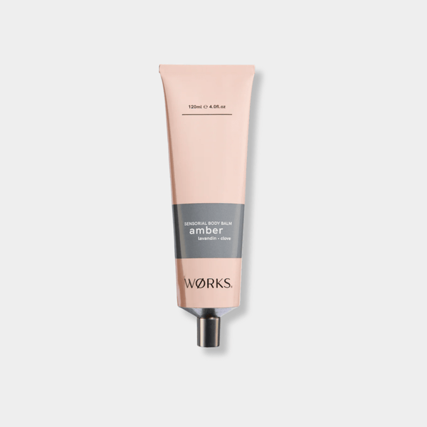 Works Body Balm amber-scented 120ml tube with plastic-free aluminium packaging for moisturizing and nourishing dry skin.