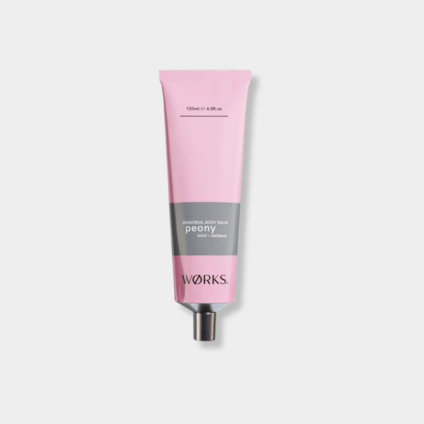 Works Body Balm Tube in pink packaging with aluminium cap, peony scent, 120ml size, moisturizing and non-greasy formula.