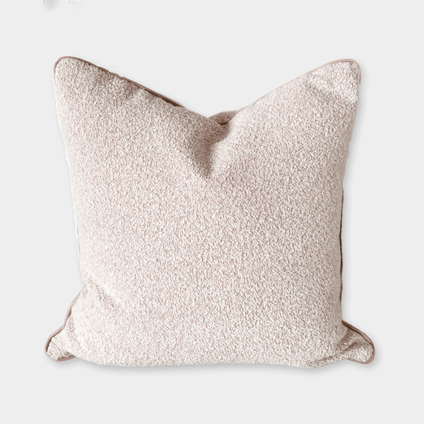 norsu STUDIO cushion in blush bouclé with blush leather piping | Norsu Interiors