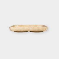 CoTheory beige travertine footed letter tray with rounded edges and natural stone texture.