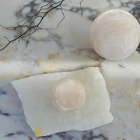 Large white onyx CoTheory Orbit Table Sculpture sphere symbolizing harmony and balance