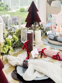 Set of 6 norsu Studio build your own Christmas crackers with velvet ribbon accents on festive table setting