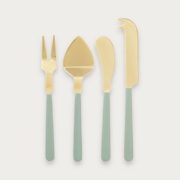 Agen cheese knife set of four with gold blades and mint handles on a soft grey background