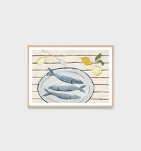 Middle of Nowhere Amalfi Catch Blue print featuring fish on a plate with lemon slices, framed in oak with white border.