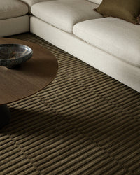 Baya Anni Floor Rug in mangrove color with textured cut and loop wool pile design