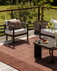 Baya Bedrock Outdoor Rug - Claret styled outdoors