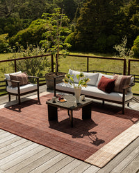 Baya Bedrock Outdoor Rug - Claret styled outdoors