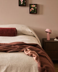 Baya Langford Throw - Raisin styled on a bed