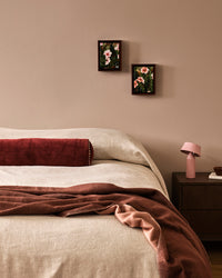 Baya Langford Throw - Raisin styled on a bed