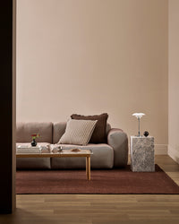 Baya Linden Floor Rug - Brick styled in a room