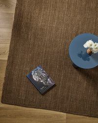 Baya Linden Floor Rug - Ironbark styled in a room