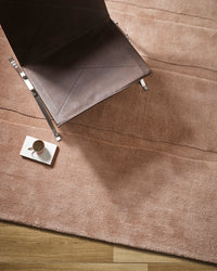 Baya Strata Floor Rug - Clay styled in a room