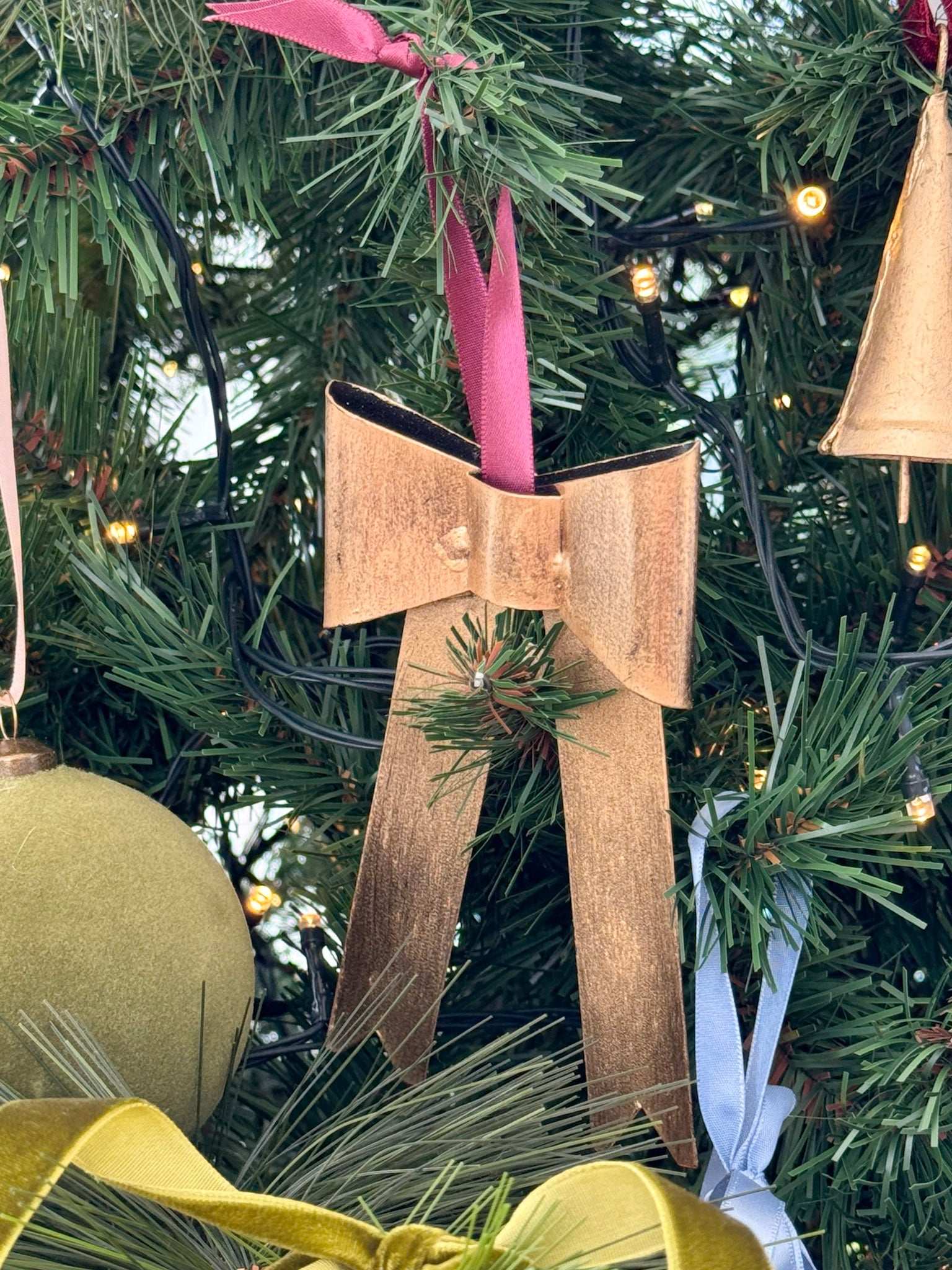 norsu STUDIO Handcrafted Gold Bow with nude satin ribbon ornament on Christmas tree