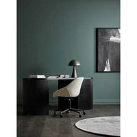 GlobeWest Tepih Neptune round dove grey rug in modern office setting with dark desk and textured chair