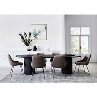 Benjamin Ripple Oval Dining Table in matt black with rippled pillar bases and oval ash veneer top in contemporary dining room setting